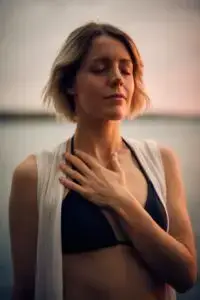 A woman holding her chest