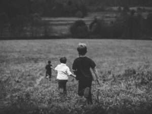 Natural Remedies for ADHD, black and white image of three boys running in a field