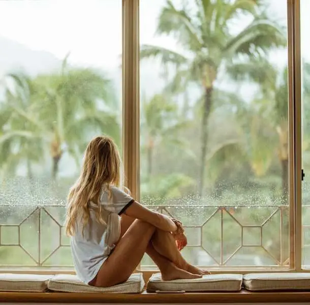 Implantation Bleeding Explained, Woman staring out window