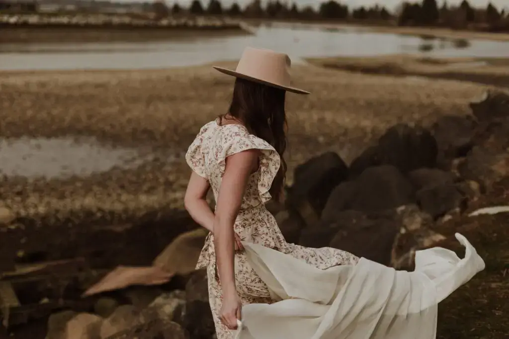 A woman in a white dress at golden hour