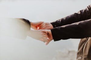 Two people holding hands.